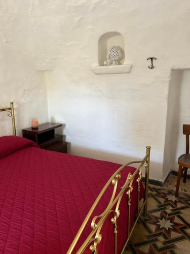 Ліжко або ліжка в номері Trullo Licchio Cisternino Ostuni Valle d’Itria