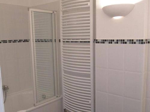 a bathroom with a shower with a glass door at Apartment in Garz with bicycle storage in Garz-Rügen