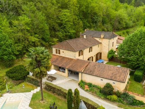 an aerial view of a house with a yard at Chic Holiday Home in Siorac en P rigord with in Siorac-en-Périgord