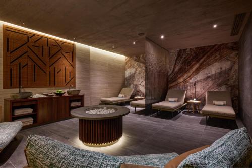a lobby with chairs and a table in a room at Almar Giardino di Costanza Resort & Spa in Mazara del Vallo