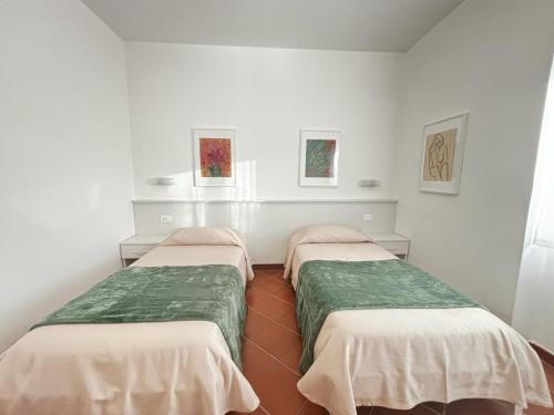 Giường trong phòng chung tại La Nuova Dimora B&B