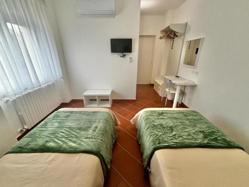 Postel nebo postele na pokoji v ubytování La Nuova Dimora B&B