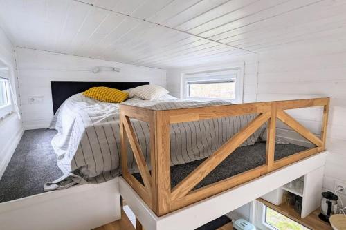 a bed in a small room in a tiny house at Tiny House Mila in Brandenburg an der Havel
