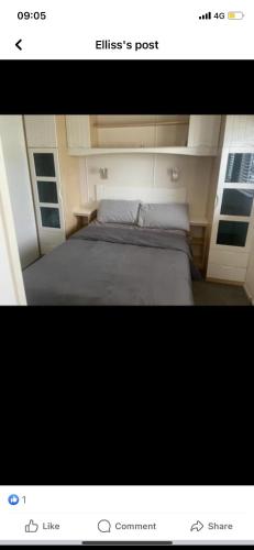 a picture of a bedroom with a bed in a room at Cosy static caravan, hunstanton in New Hunstanton