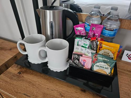 a tray with cups and drinks on a table at The Ivernia hotel in Skegness