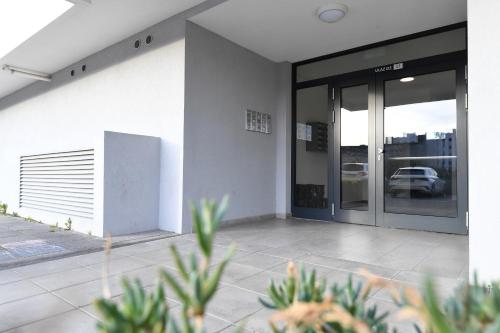 an entrance to a building with a glass door at K&P - Zadar Luxurious Retreat - BRAND NEW !! in Zadar