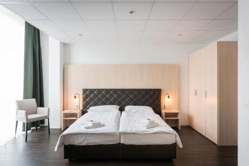 Los Lorentes Hotel Bern Airportにあるベッド