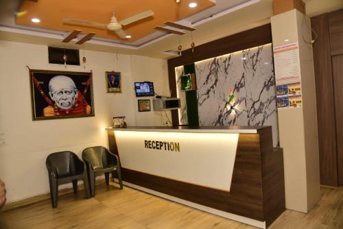 TV a/nebo společenská místnost v ubytování Hotel Sai Nanda