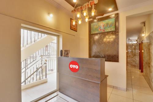 a door in a room with a stop sign on it at Hotel O IRA Comforts in Bengaluru