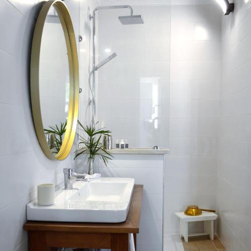 a bathroom with a sink and a mirror at VILLA EDO in Gammarth