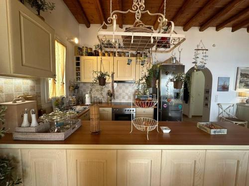 a kitchen with a large wooden counter top in a room at Beachfront House Kipri in Kypri