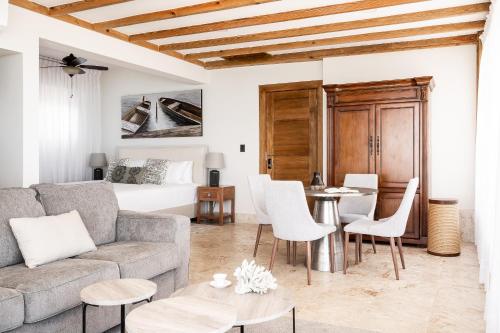 a living room with a couch and a table at Cofresi Hills Residence in Gurapito
