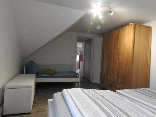 a attic bedroom with two beds and a bed istg at Ferienwohnungen am Hauptplatz in Pirna