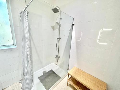 a shower with a glass door in a bathroom at St Julians - Balluta Bay large 3 bedroom apartment in Sliema