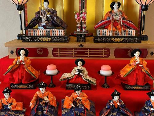 a group of dolls sitting on a table at Kansai Airport Washington Hotel in Izumi-Sano