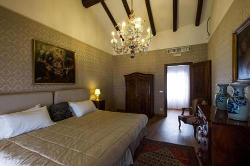 Postel nebo postele na pokoji v ubytování Relais Alberti