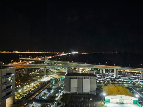 a view of a busy city at night at Kansai Airport Washington Hotel in Izumi-Sano