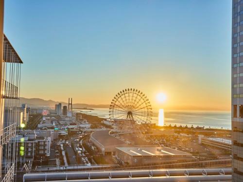 a view of a city with a ferris wheel at Kansai Airport Washington Hotel in Izumi-Sano