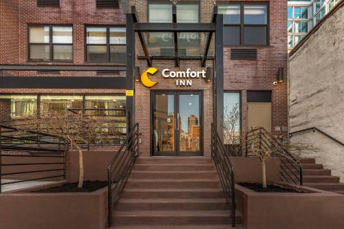 a building with a sign that reads comfort inn at Comfort Inn Manhattan - Midtown West in New York