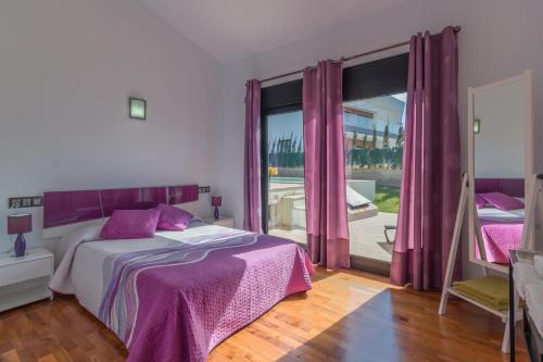 a bedroom with a bed and a large window at Llucmajor -1630-21 Mallorca in Llucmajor