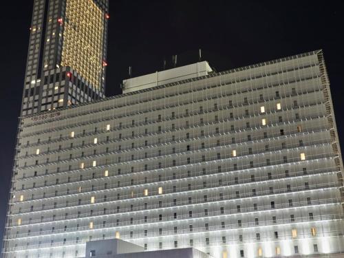 a large building with many windows at night at Kansai Airport Washington Hotel in Izumi-Sano