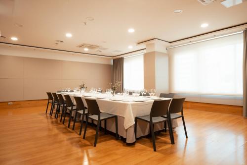 a conference room with a long table and chairs at Sancho Ramirez in Pamplona