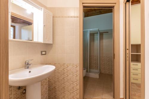 a bathroom with a sink and a shower at Guest House da Generoso in Pesaro