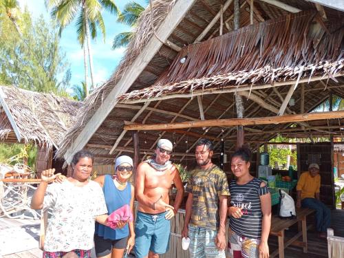 a group of people standing in front of a building at Fam Homestay in Fam