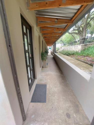 an empty hallway of a building with a wooden ceiling at Lieu De Grace in Johannesburg