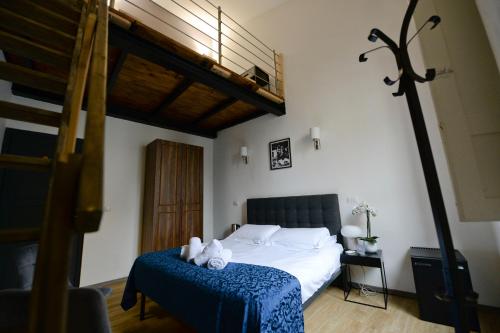 a bedroom with a bed with two teddy bears on it at Palazzo Oliveto in Florence