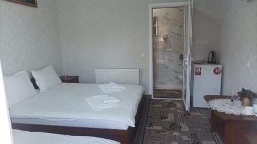 Una cama o camas en una habitación de Готель Ассоль