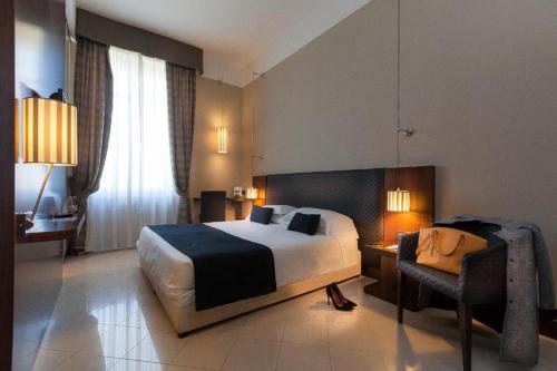 Una cama o camas en una habitación de TH Roma - Carpegna Palace