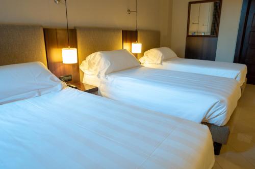 Una cama o camas en una habitación de TH Roma - Carpegna Palace