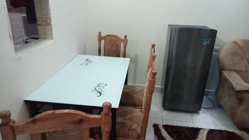 a table with a drawing on it next to a heater at FAVOURED EVAMAX in Eldoret