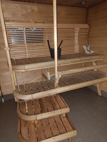 a wooden bunk bed in a room at Chalet Pellonranta 2 in Pello