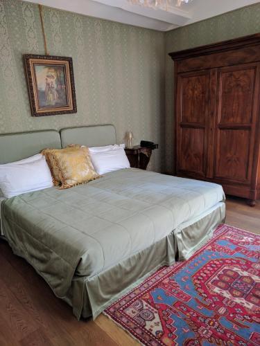 Postel nebo postele na pokoji v ubytování Relais Alberti