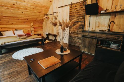 a living room with a bed and a table at Labieši in Jūrmala