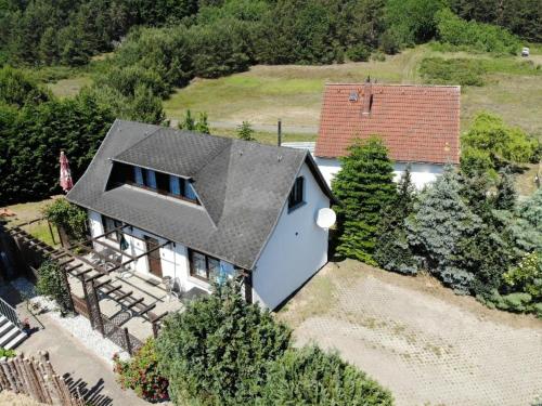 an aerial view of a house with a gray roof at Ferienhaus Kreß rechts in Ostseebad Sellin
