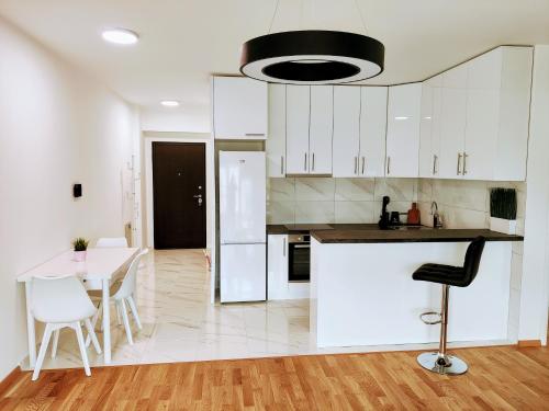 Kuchyň nebo kuchyňský kout v ubytování Mango Apartments