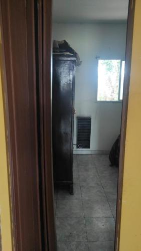 a hallway with a black cabinet in a room at Don Ramón Casa de campo in Villars