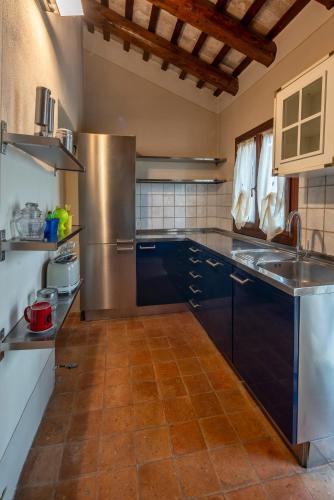 Kuchyň nebo kuchyňský kout v ubytování La tua villa