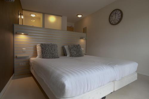 
Een bed of bedden in een kamer bij Hampshire Boshotel - Overberg
