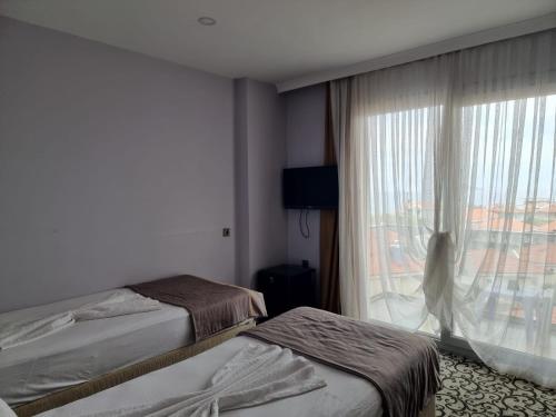 Katil atau katil-katil dalam bilik di Elisa Hotel