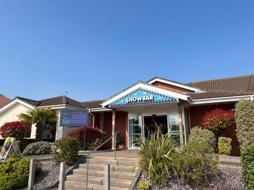 a building with a sign on the front of it at Cedars Southview, Skegness in Skegness