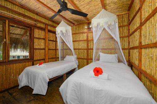 Ένα ή περισσότερα κρεβάτια σε δωμάτιο στο Ocean Pearl Beach Lodge