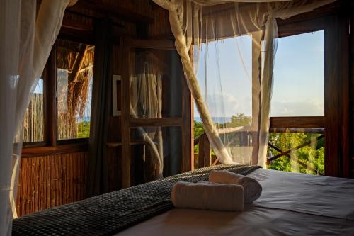 Ένα ή περισσότερα κρεβάτια σε δωμάτιο στο Ocean Pearl Beach Lodge