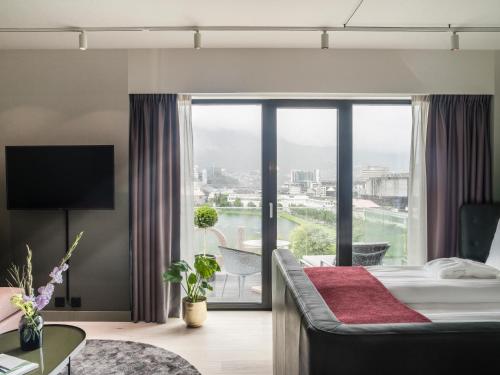En eller flere senge i et værelse på Hotel Norge by Scandic