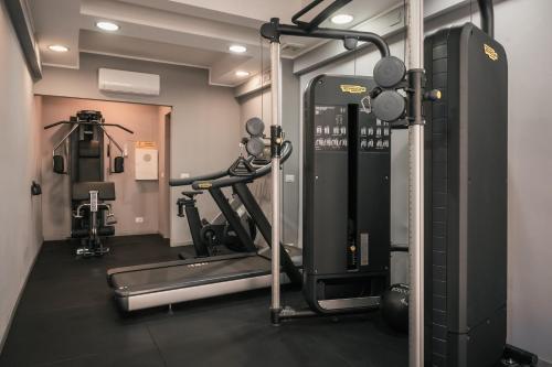 a room with a gym with a treadmill at Twentyone Hotel in Rome