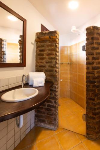 a bathroom with a sink and a shower at Duro Beach Hotel in Cumbuco