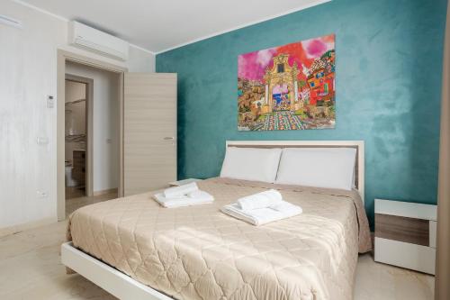 Posteľ alebo postele v izbe v ubytovaní Azzurra Apartments
